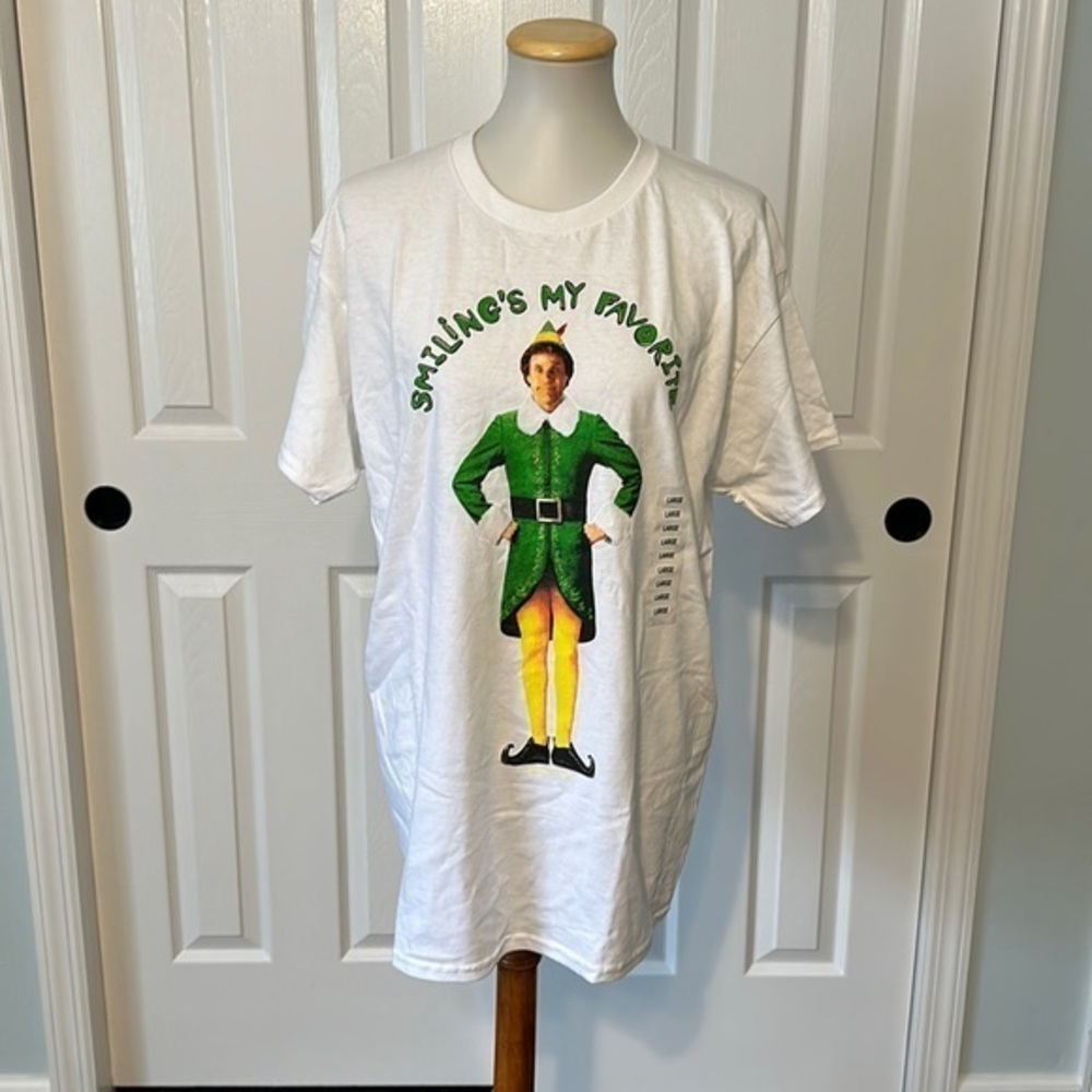 NEW WITH TAGS “Smiling’s My Favorite” unisex T-shirt from Elf 3 shirts available